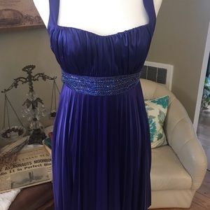 Purple cocktail dress with bead embellishments